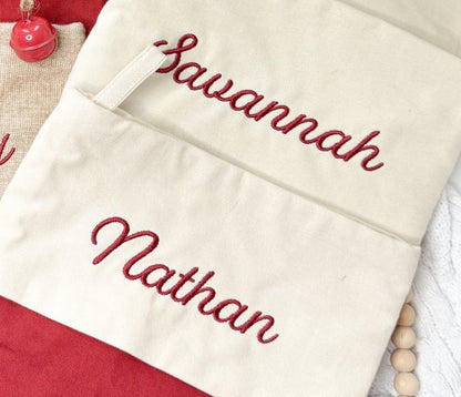 Script name embroidery detail on Christmas stockings